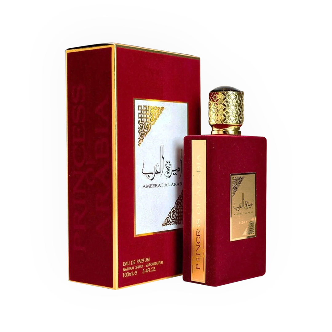 Packshot du parfum Ameerat Al Arab Rouge 100 ml par Asdaaf, avec un flacon recouvert de velours rouge et des détails dorés raffinés, accompagné d'une boîte assortie rouge et or, incarnant l'élégance et le luxe arabes.