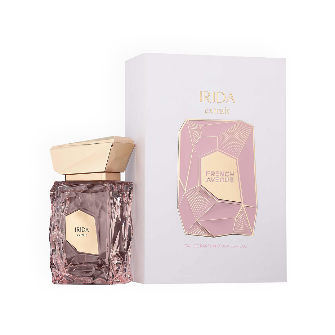 L'ensemble complet de l'Extrait de Parfum Irida de French Avenue présenté avec son packaging raffiné. La boîte blanche et rose arbore un design de pierres précieuses dorées, mettant en avant l'élégance et la préciosité du produit. Ce parfum de 100ml promet une expérience olfactive luxueuse et distinctive, idéale pour les amateurs de senteurs élégantes et audacieuses.