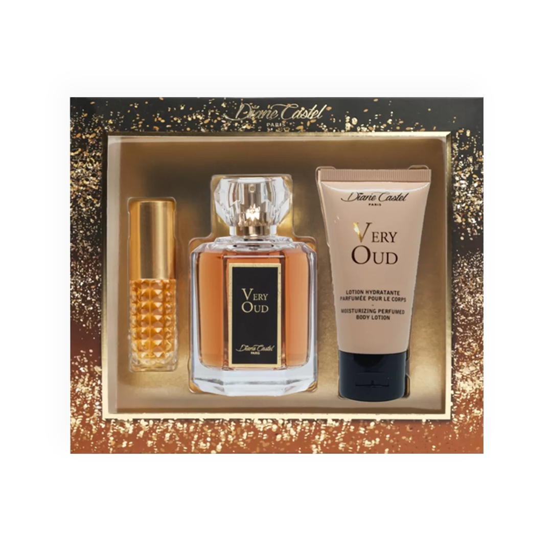 Packshot du coffret cadeau Very Oud par Diane Castel, comprenant un flacon de parfum ambré raffiné, une lotion hydratante parfumée et un vaporisateur de voyage doré, présenté dans un coffret luxueux noir et doré scintillant, idéal pour une touche de sophistication et d'élégance orientale.